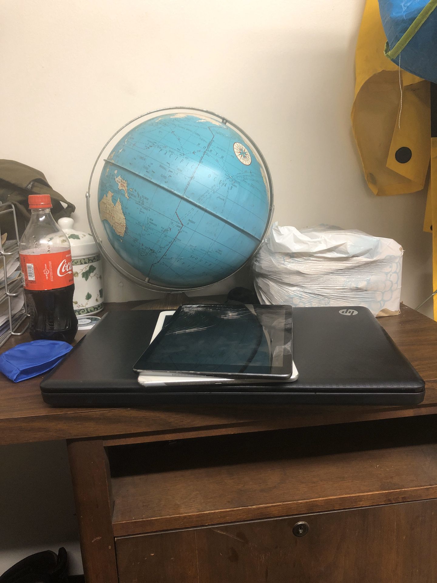 2 Apple mini tablet and a dell laptop