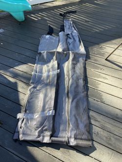 New Never Used UltraTech Dewatering Bag with lock down bars. Size is approximately 6 feet by 3 feet.