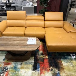 New Reversible Sectional.  Leather Match.  Tangerine 🍊 Or Grey.  110x68Dx29H.  Free Delivery!