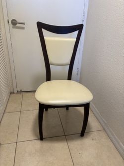 All Three wooden chairs with built in cushion back and seat for $30