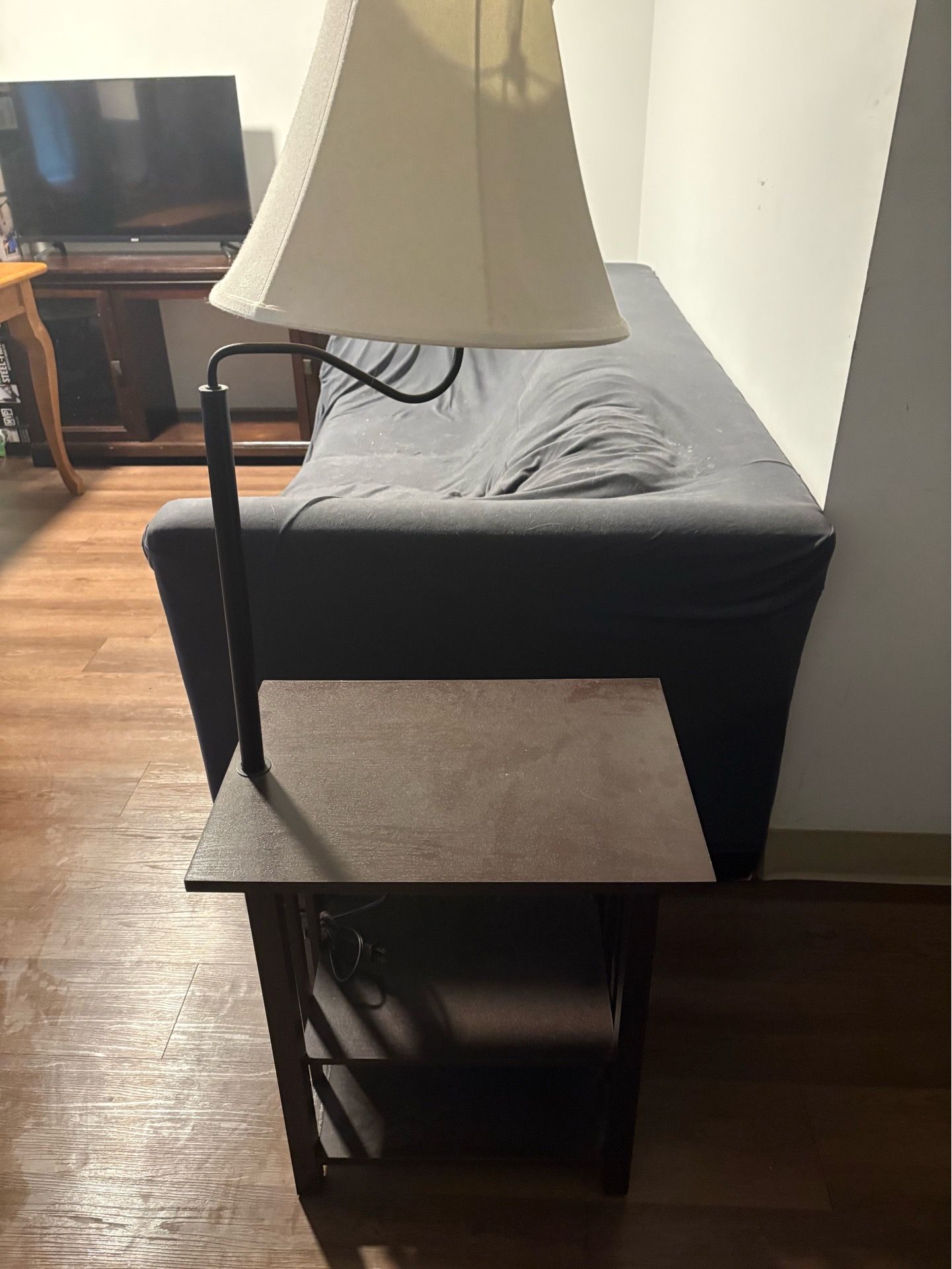 Wooden side table with lamp