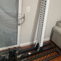 Like new Squat Rack with spotter arms and weight holders