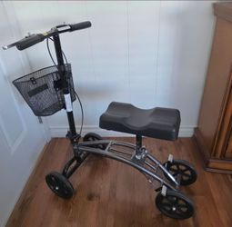 KNEE WALKER/SCOOTER:  ADJUSTABLE, FOLDABLE, DUAL HAND BRAKES, BASKET. CHARCOAL FRAME. EXCELLENT CONDITION!