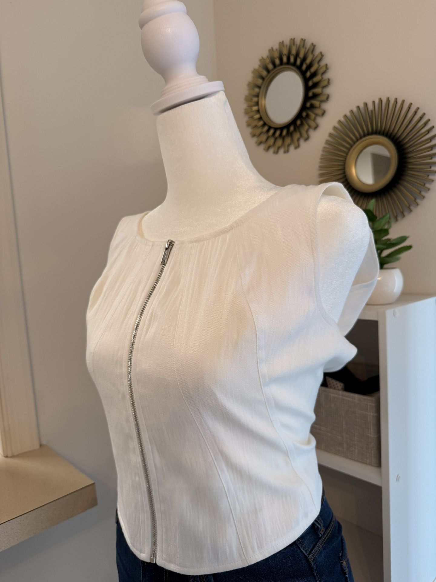modern sleeveless white top.