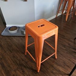 Orange metal stools