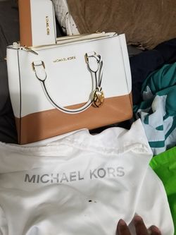 Michael kors original purse with matching wallet. 300 each