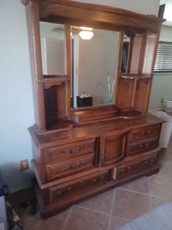 Free.  Solid wood. Dresser with mirror.