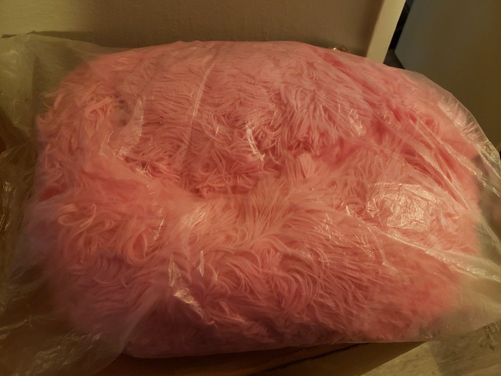 Small fluffy pink pet bed