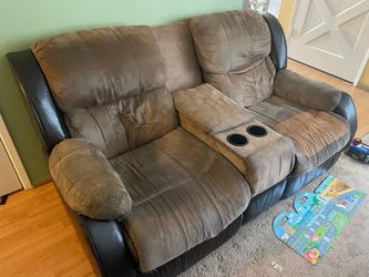 Brown reclining sofa with cup holders