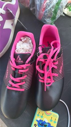 Pink cleats and black cleats