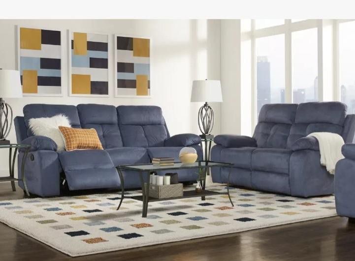 Like new; Corrine Blue Love Seat And Sofa(reclining). 