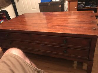 Nice coffee table with drawers on both side. Sold wood very durable