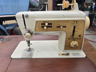 Sewing machine with cabinet