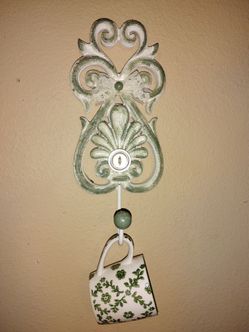 Vintage cottage style decor with hanging tea cup