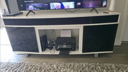 White TV Stand with Integrated Soundbar and Glass Doors