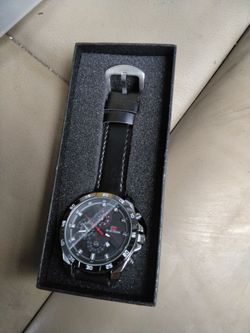 Va va voom Style: Large chronograph-style quartz watch with black/red dial and leather-look strap.