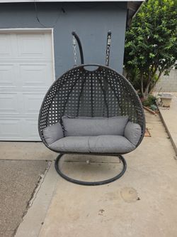 2-person hanging wicker egg chair with a s