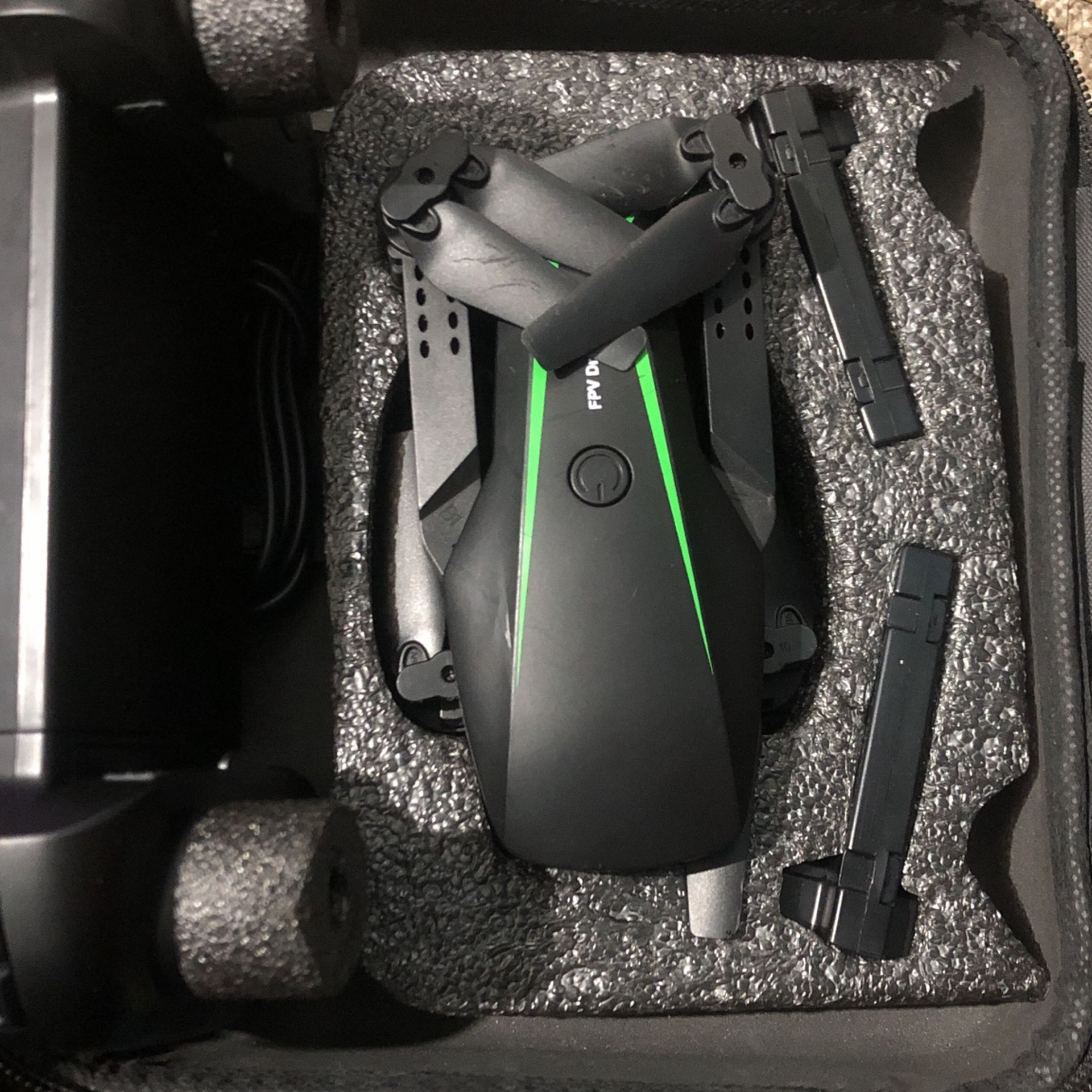 It has a drone with a card with the controller