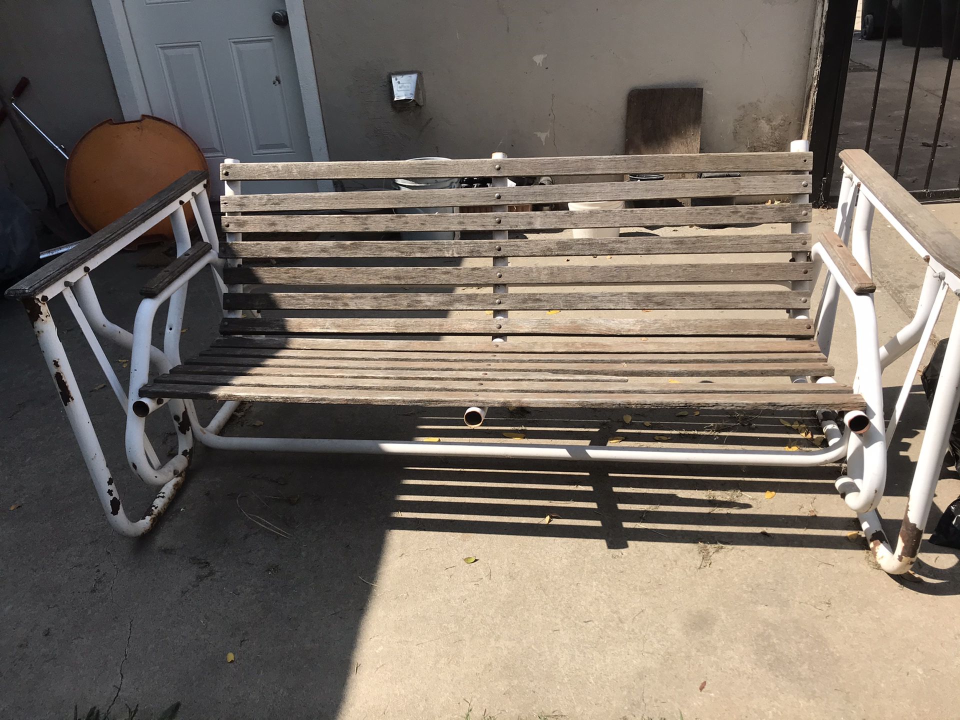Outdoor swing chair with 1 small piece of wood missing