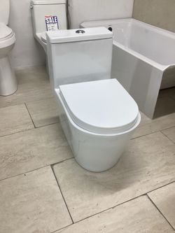 One piece toilet white color dual flush system elongated bowl fully skirted Softclose seat with tornado flush ready for pick up today