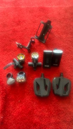 Bicycle, accessories, five separate lights, a set of petals, phone holder, water bottle holder.