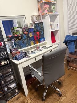 Selling my white table , grey chair and white pantry all the way to the right
