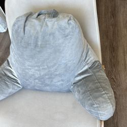 gray plush back support pillow