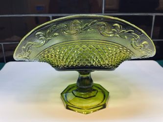 Antique Indiana glass olive green curved pedestal bowl. Also used as a banana bowl