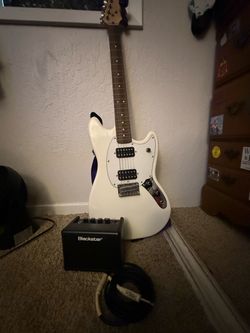 White Electric Guitar with Blackstar Amp and Cable