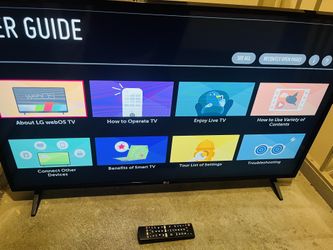 43 Inch LG Smart Tv&Remote +“ Nice Glass Tv Stand And Mount “