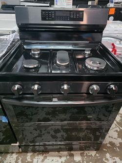New Samsung Gas stove top with a double oven (47" H x 30" W x 28.7")