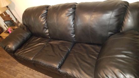 2 black leather couches