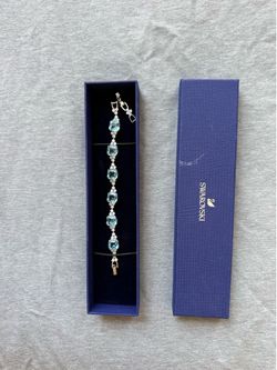 This is a Swarovski Gema soft bracelet in rhodium finish featuring icy-blue crystals