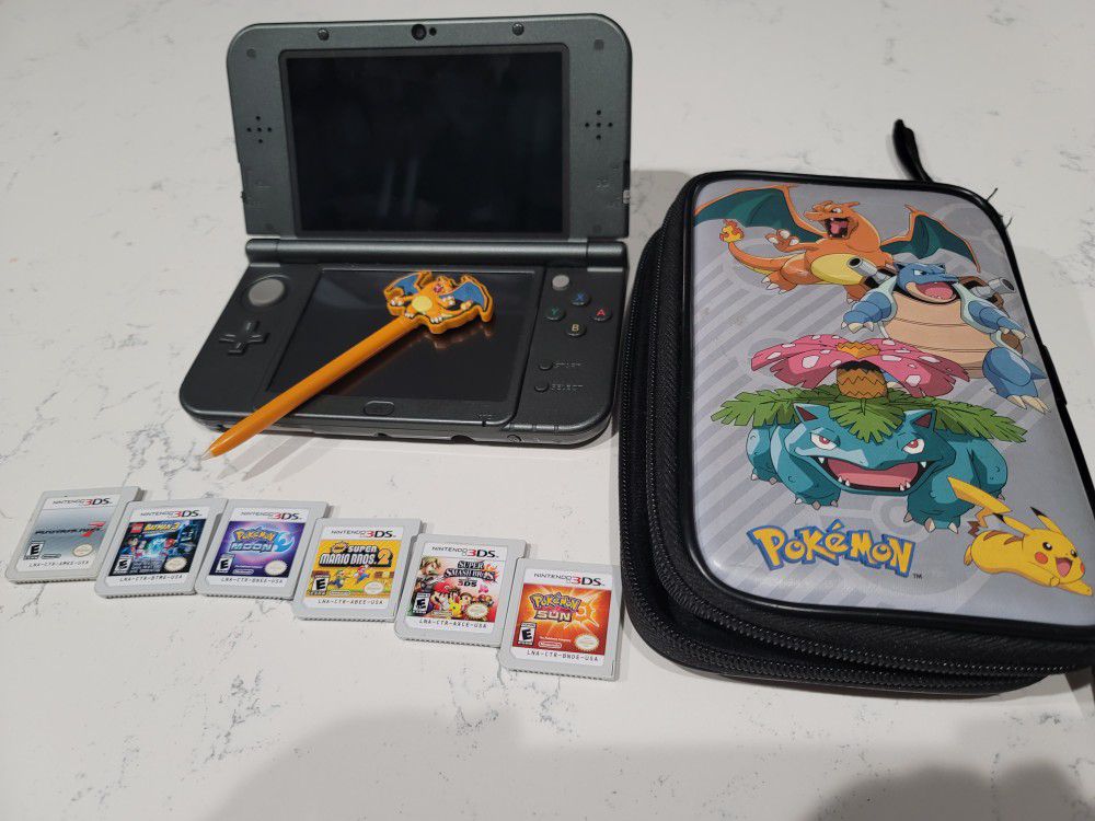 Nintendo 3D XL with Pokémon case and pen and 6 games. No charger