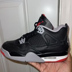 Air Jordan 4 Retro "Bred Reimagined" sneaker in black leather with cement grey and fire