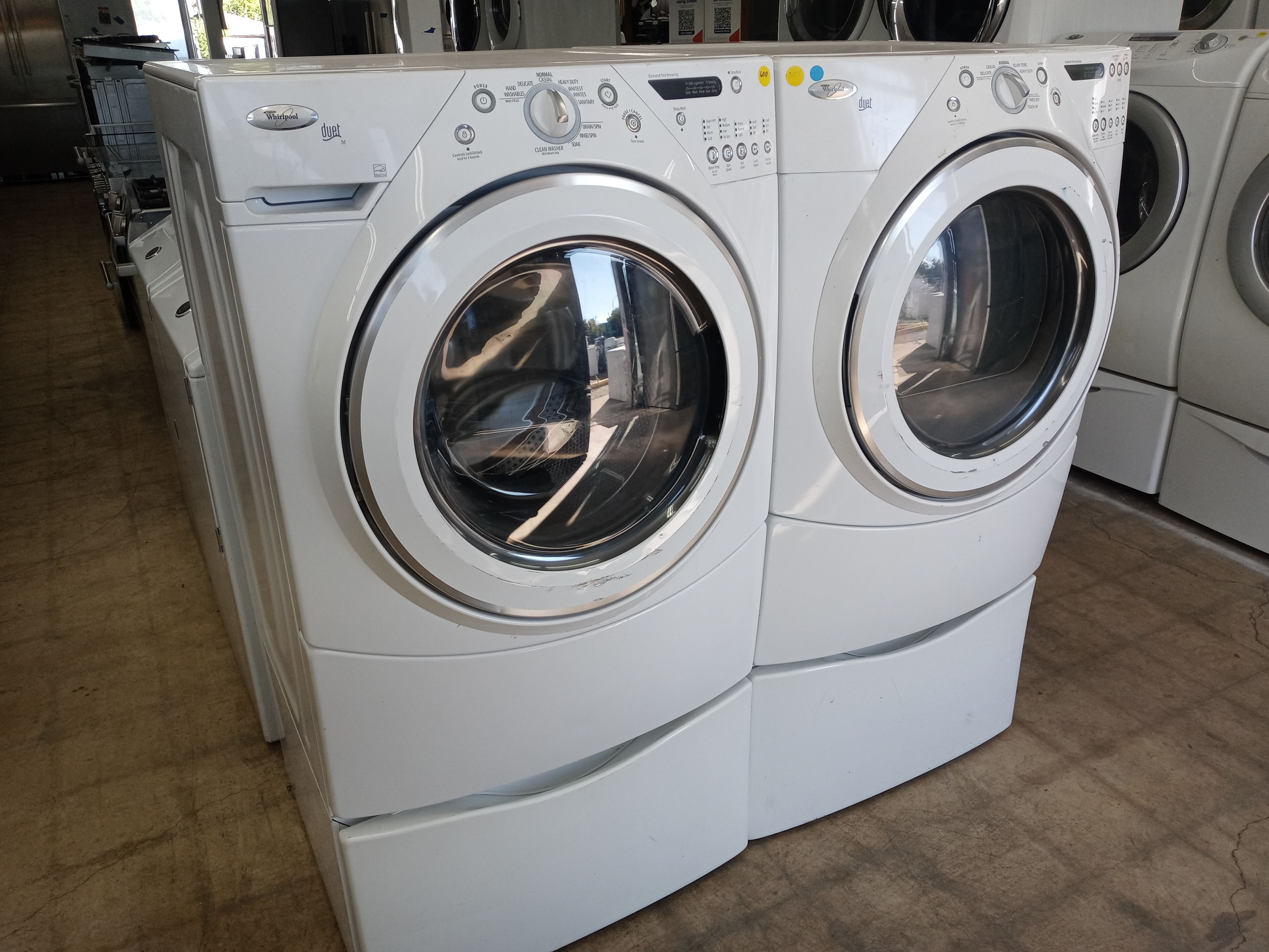 Whirlpool Duet front load washer and dryer set on pedestals - Free delivery