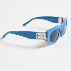 Sunglasses with a gold logo. Brand new.