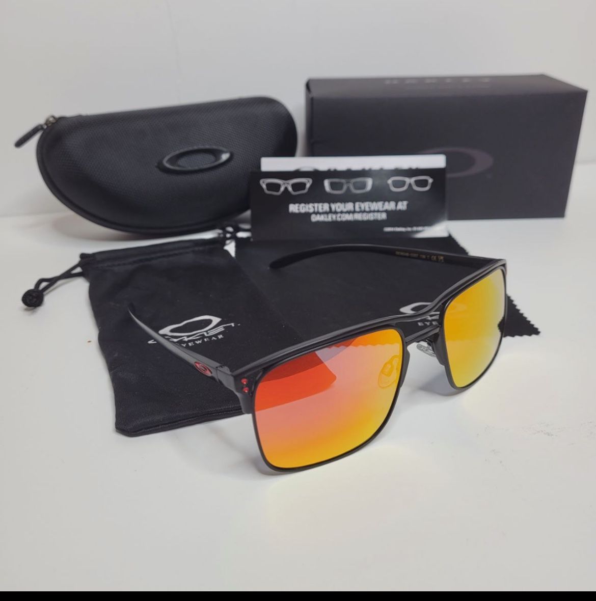 Oakley Holbrook Ti Titanium Sunglasses- Black Frame / Orange Lenses