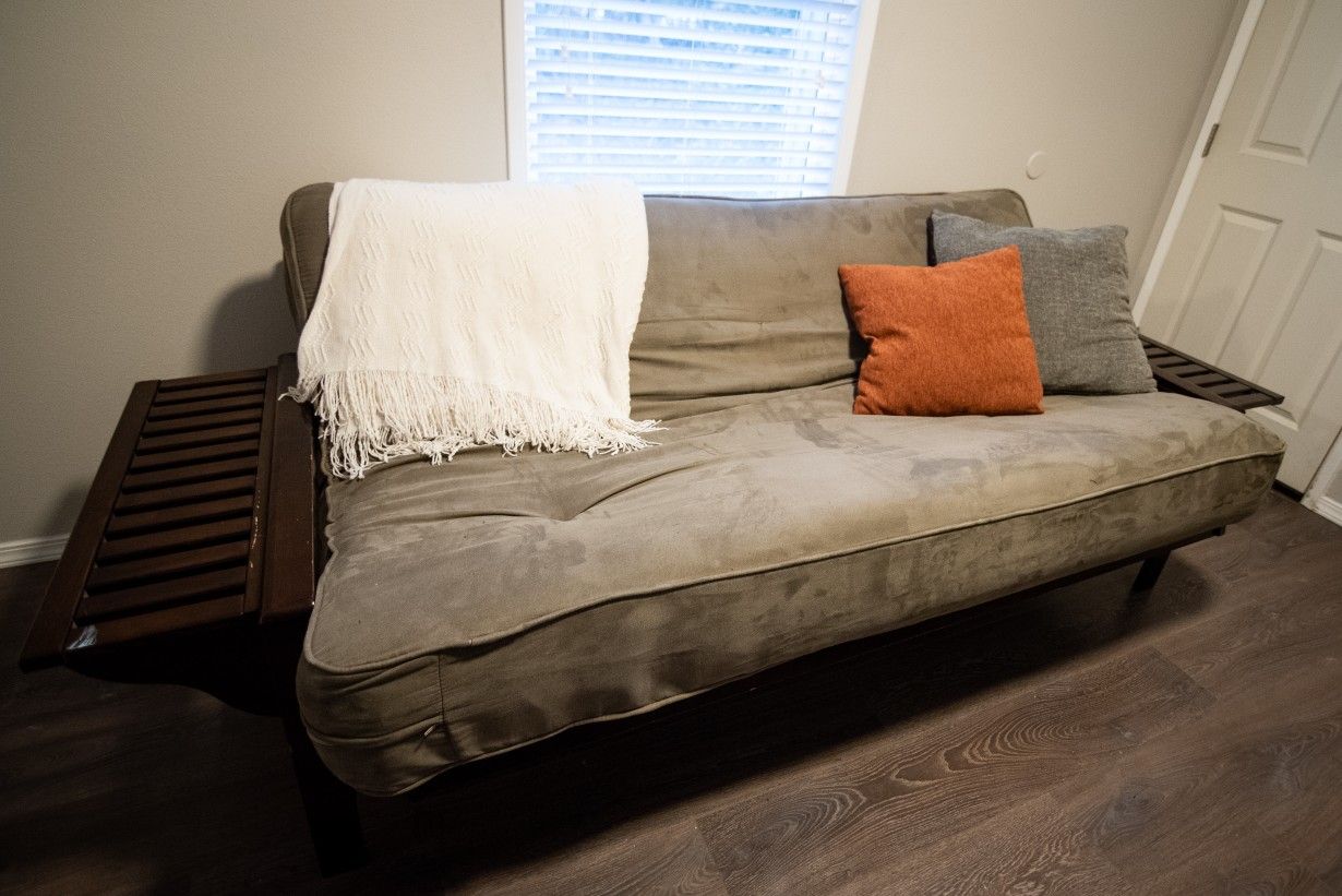 Futon with foldable arm rests