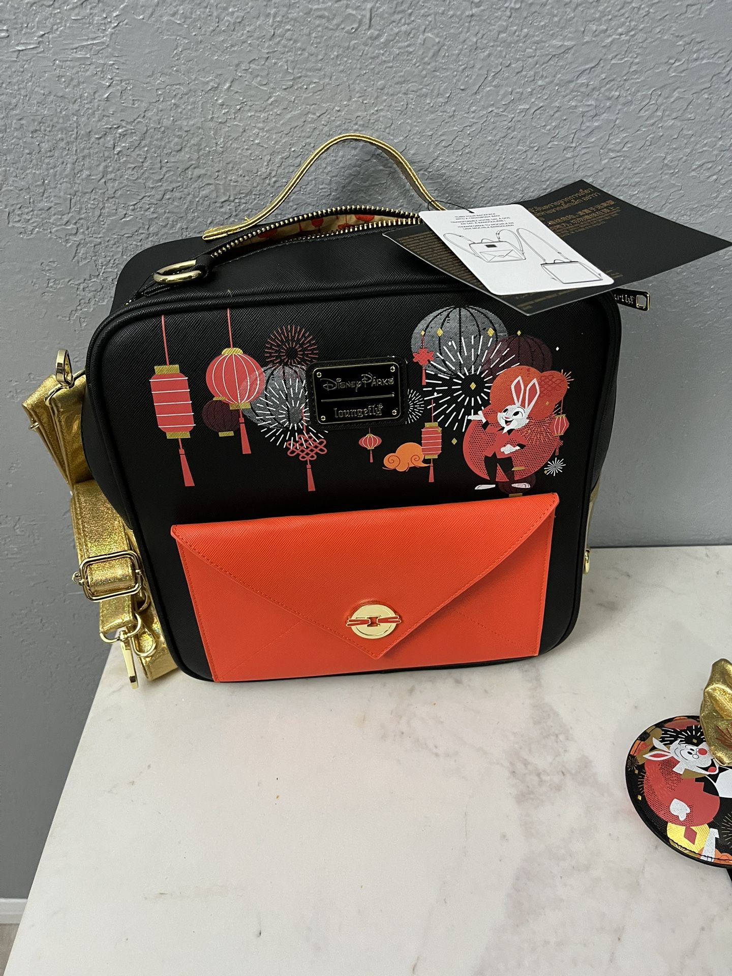 NEW Disney Parks Loungefly Convertible Bag Backpack also has a strap that can be a crossbody bag.