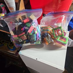 Wooden Blocks And Shapes And Plastic Squares That Make Cubes