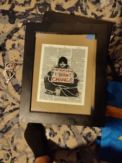 Banksy street art in frame keep your coins on when changed homeless guy