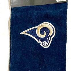 This is an NFL Los Angeles Rams embroidered tri-fold golf towel. The towel is officially licensed, made of 100% cotton, and features the Los Angeles R