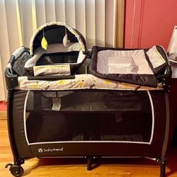 Play pen with bassinet and changing station