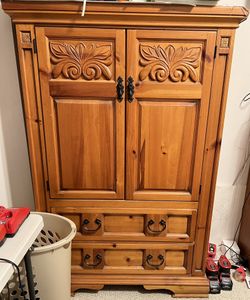 Wooden Armoire with Carved Design
