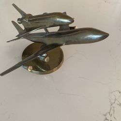 vintage brass model of a NASA Space Shuttle piggybacked on a Boeing 747 Shuttle Carrier Aircraft.