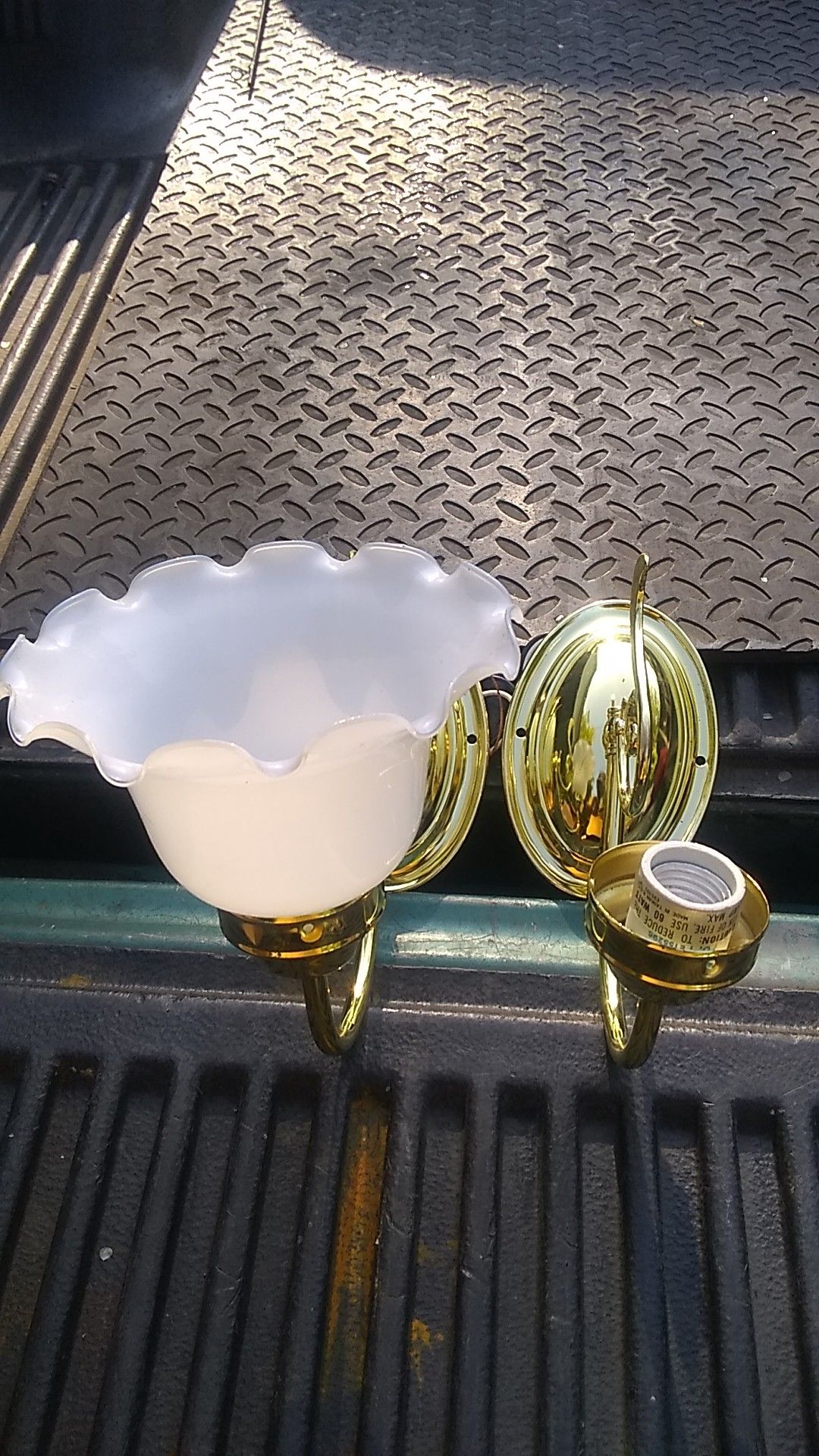 Wall fixture polish brass. White opal ... width 6 1/2 height 8 1/2 . One glass fixture broke.