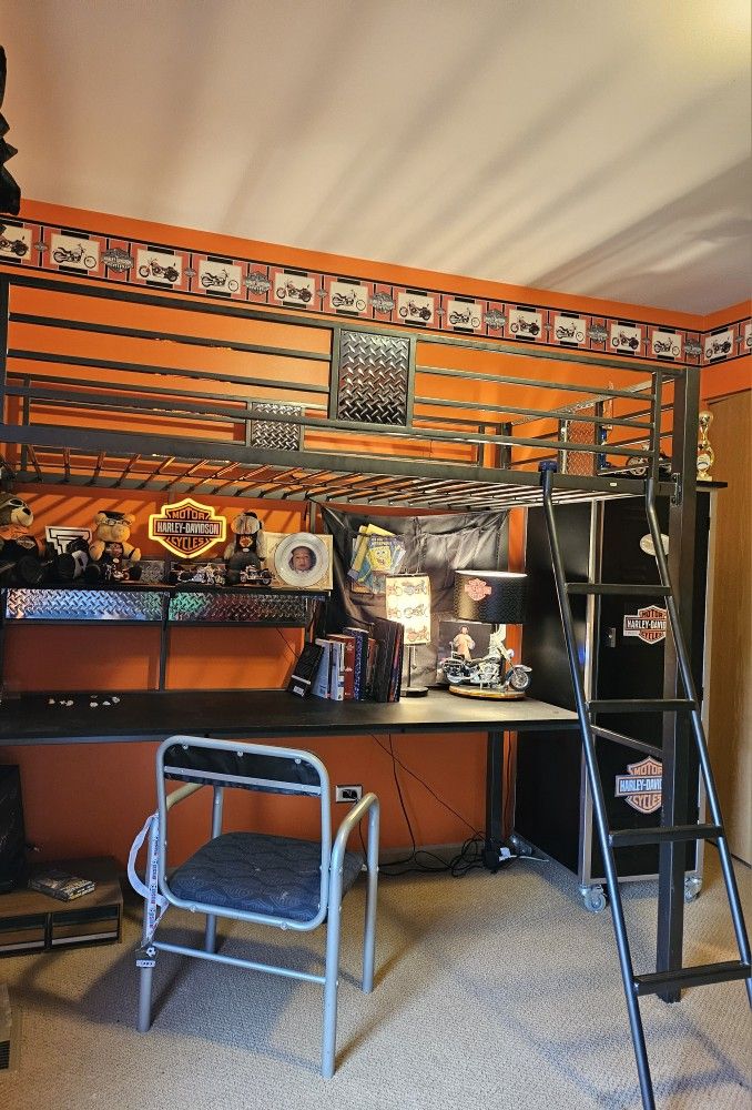 Black Metal loft Twin Bed.
Includes a built-in desk, Chair, and ladder.