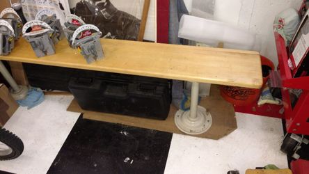 Wooden bench with metal bolt down legs usually found in sports room