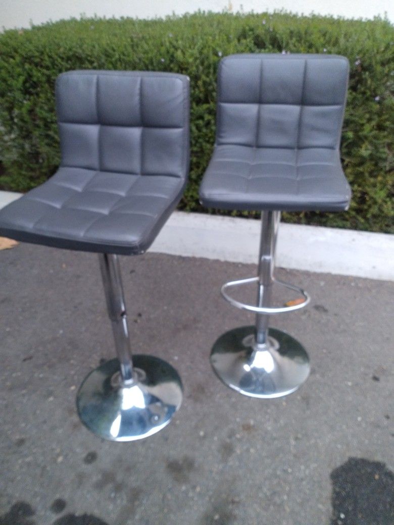 Two Grey Swivel Bar Stools